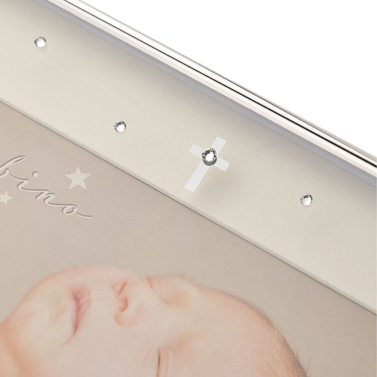 Silver plated frame top edge with crystal-like studs and small charm detail.