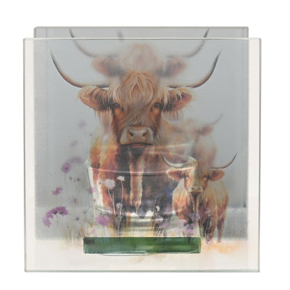 Glass tealight holder front view with Highland cow artwork over teal tray