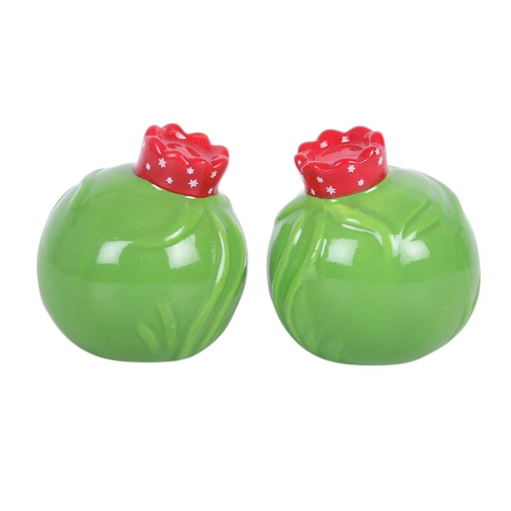 Green brussels sprout salt and pepper shakers with red star-patterned caps