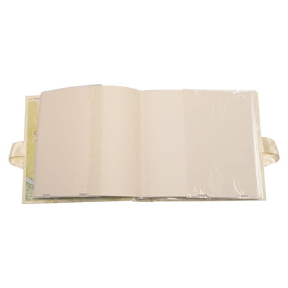 Open Winnie the Pooh photo album with blank pages and satin ribbon ties.