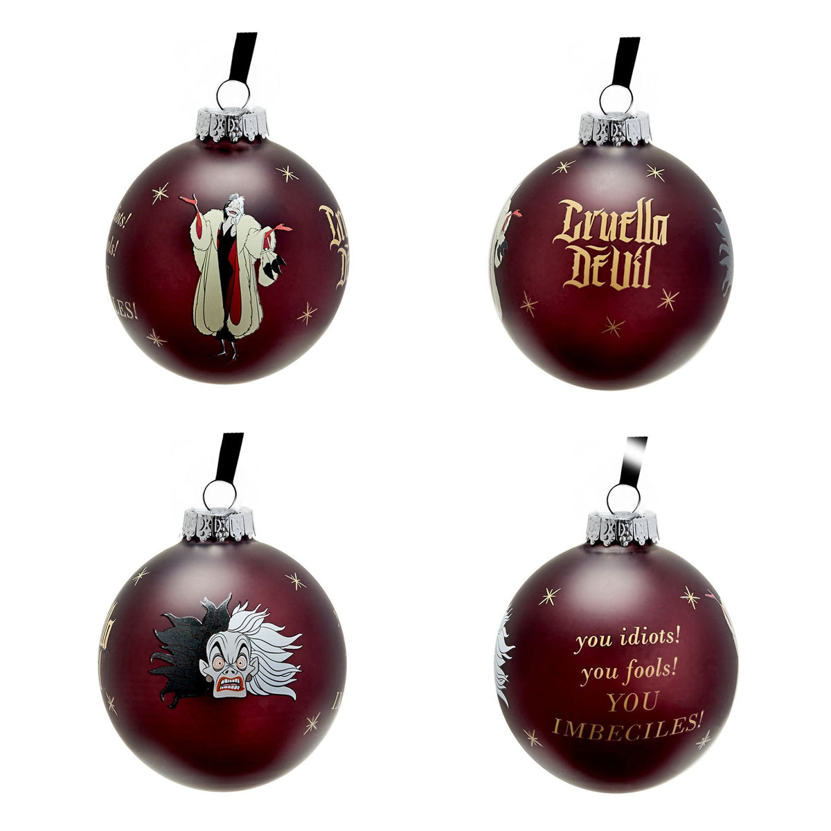 Burgundy villain baubles with silver caps, including “Cruella DeVil” and a quote on one