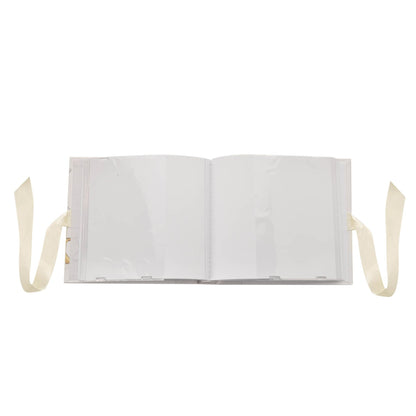 Opened photo album with two blank pages spread and ribbon ties on sides