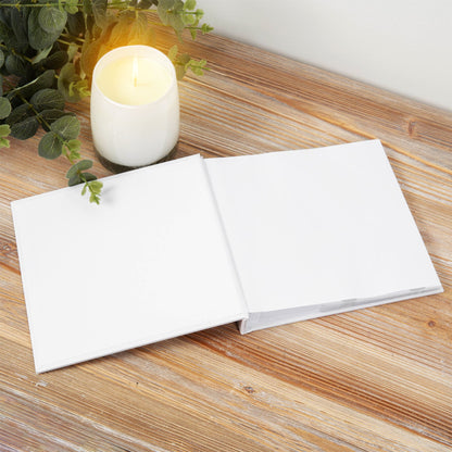 White first communion photo album open with two blank pages for 4x6 photos