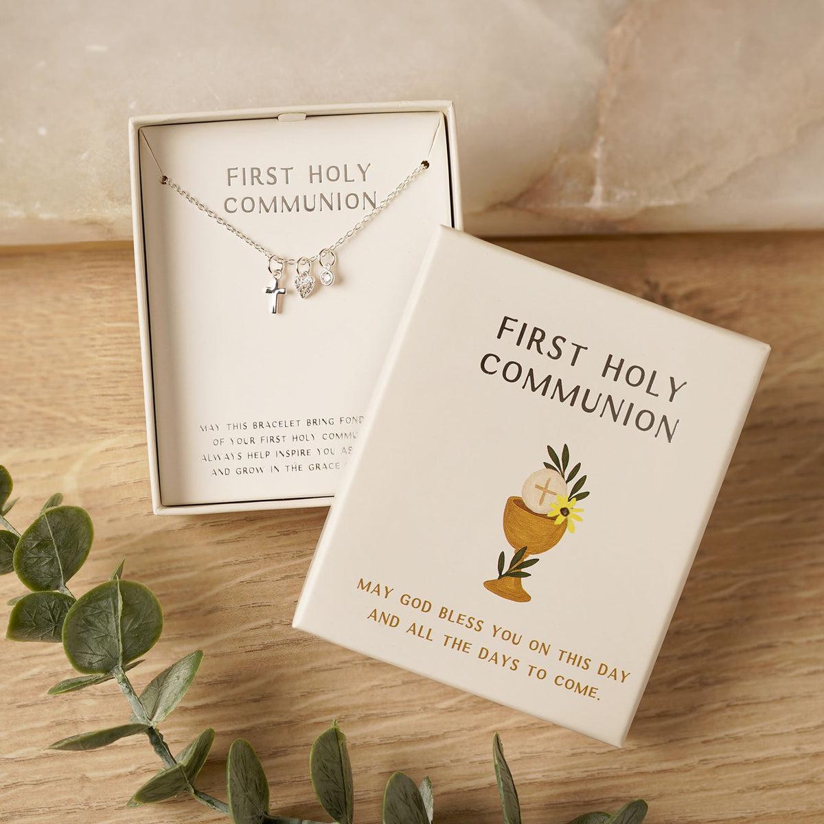 First Holy Communion necklace with silver cross pendant, shown in gift box