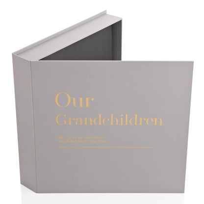 Gray scrapbook album cover with gold 'Our Grandchildren' title and open top edge