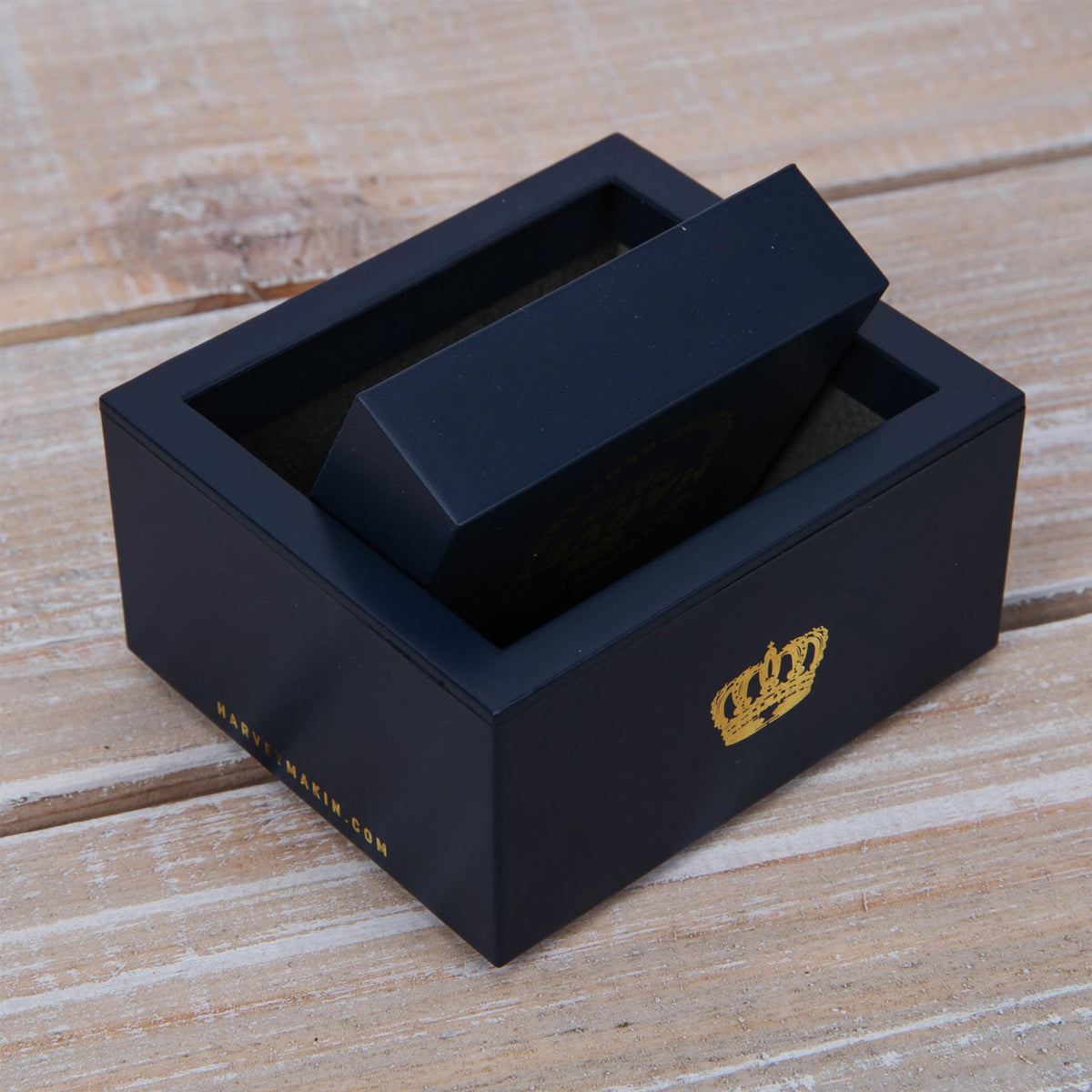 Dark navy presentation box with lid open, cufflink insert compartment visible