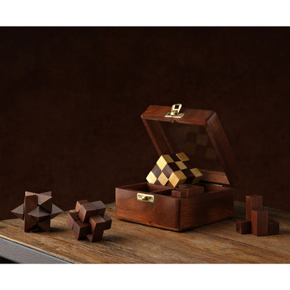 Wooden puzzle box with brass latch and geometric wood puzzle pieces outside