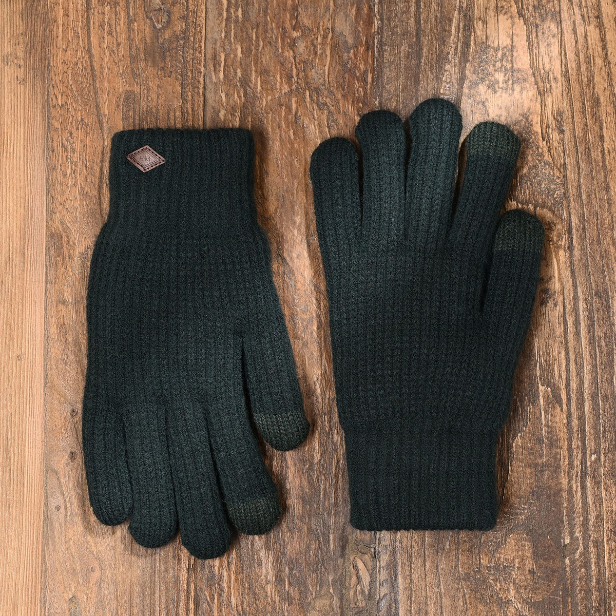 Pair of dark green knitted gloves with leather logo patch