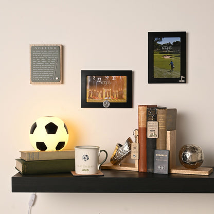 Small black 6x4 football photo frame with clear window and soccer ball emblem