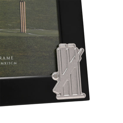Close-up of black 4 x 6 photo frame with cricket bat and wickets metal charm
