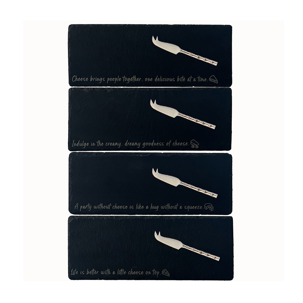 Four dark slate cheese boards with engraved quotes and small spreader knives