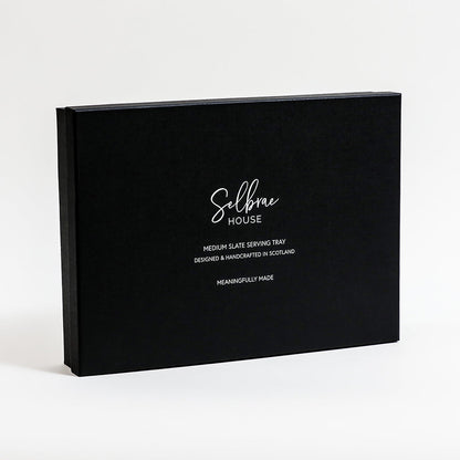 Black serving tray packaging box with branding and tray description.