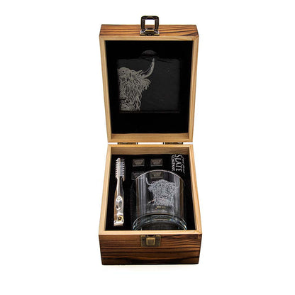 Opened wooden drinks set case with cow-etched glass, black pouch, and bar tools