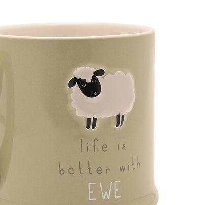Close-up of cream mug with ewe graphic and 'Life is better with EWE' text