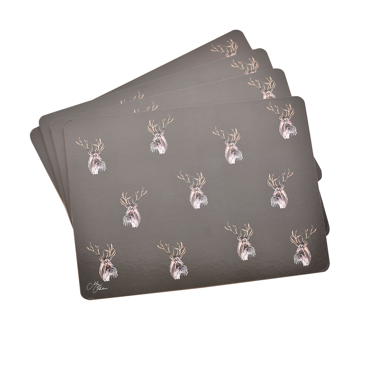Stack of four dark placemats with repeating stag head print in gold and white.