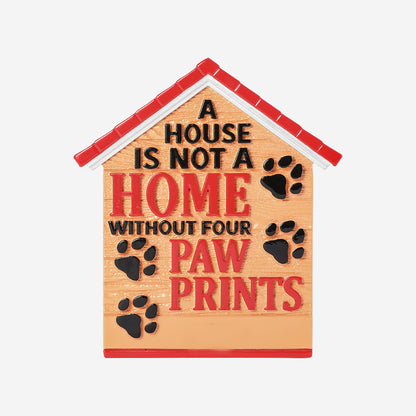 House-shaped fridge magnet with red roof, paw prints, and quote text