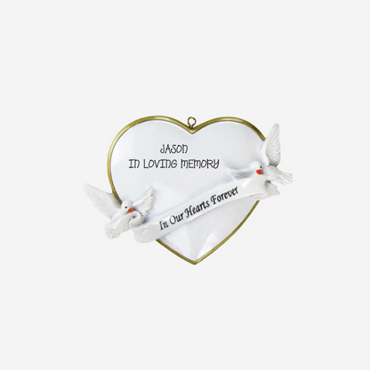 A white heart-shaped memorial ornament with a gold border, featuring two white doves and a banner that reads 'In Our Hearts Forever,' with the text 'JASON IN LOVING MEMORY' written on the heart.