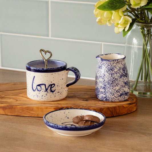 Large ceramic love mug with blue speckle finish, heart-topped lid and side handle