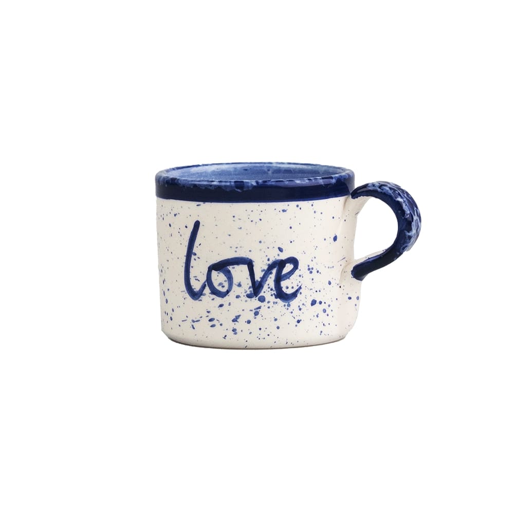 Large ceramic mug with blue speckle glaze and handwritten 'love' on front