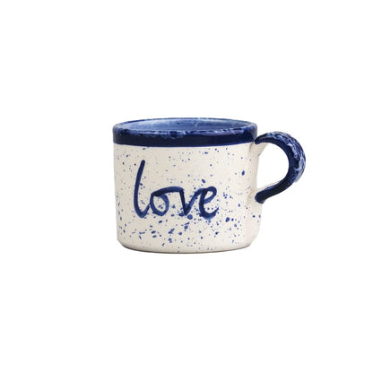 Large ceramic mug with blue speckle glaze and handwritten 'love' on front