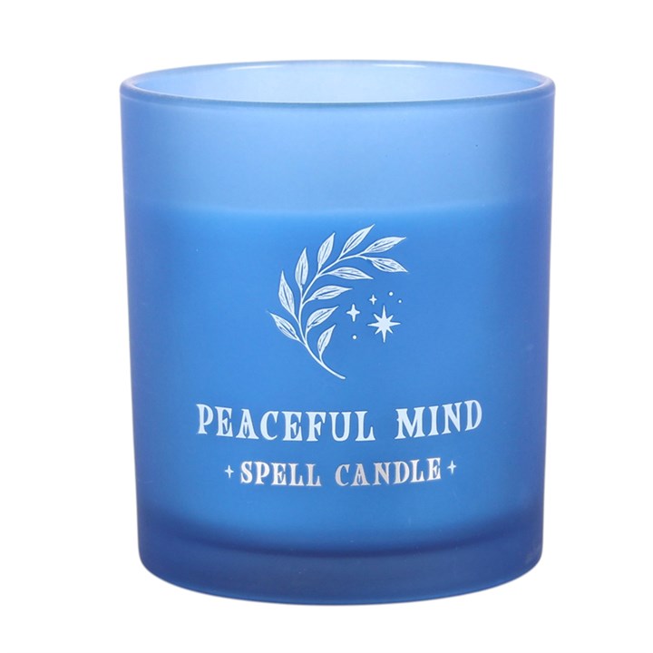 Blue scented candle jar with white floral "Peaceful Mind + Spell Candle" text