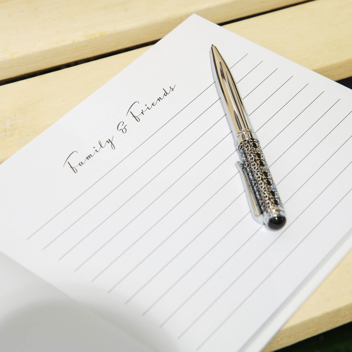 Condolence notebook page with 'Family & Friends' heading and wide ruled lines