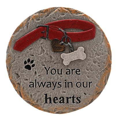 Pet memorial stone with red collar strap, paw print, bone charm, and “You are always in our hearts”.