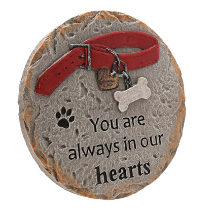 Pet memorial stone front with red collar, heart pendant, paw print, and “You are always in our hearts”.