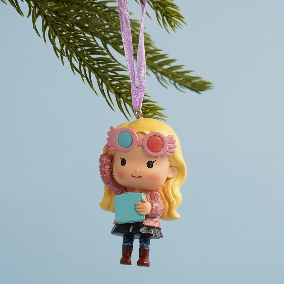 Luna Lovegood hanging tree decoration, blonde with pink glasses and blue book