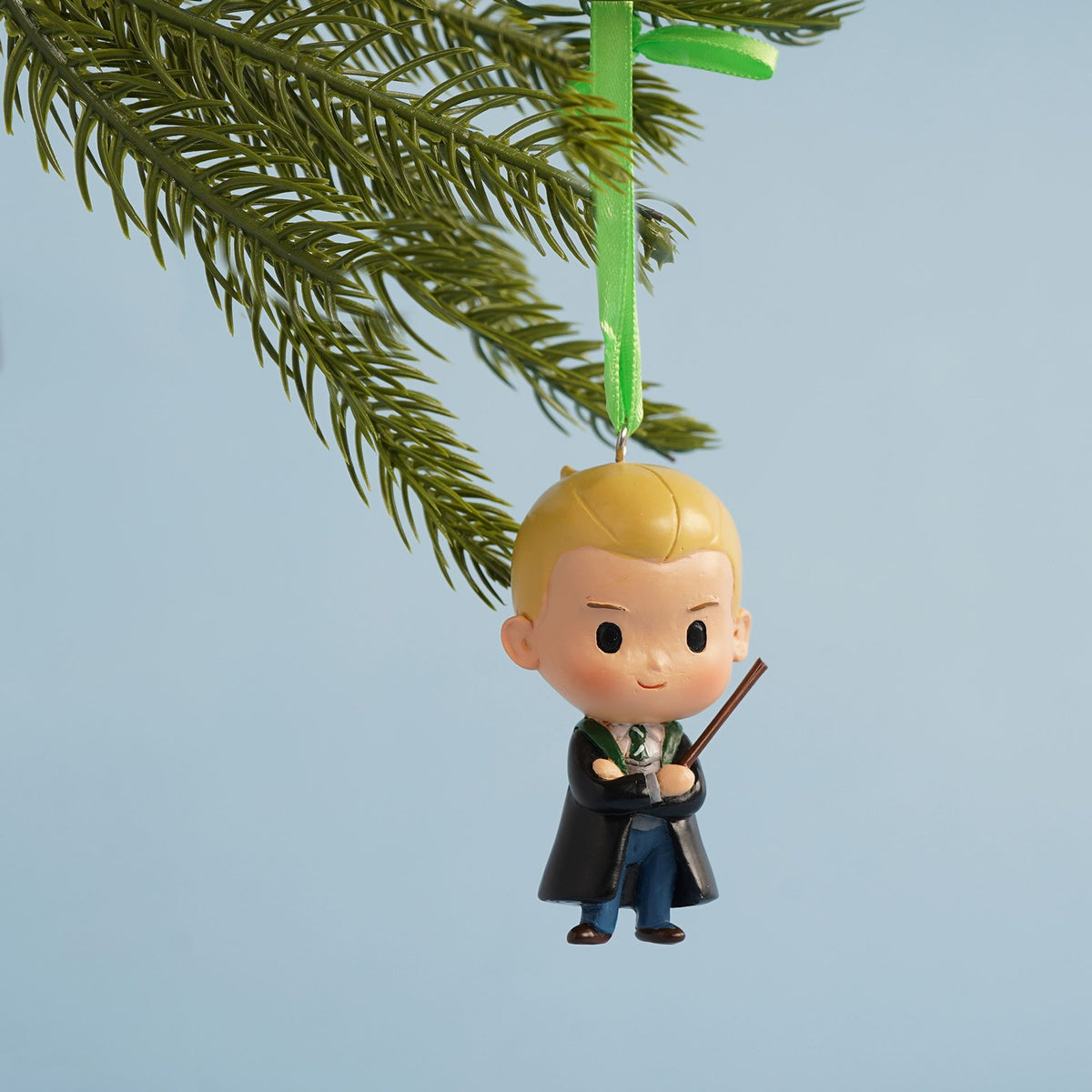 Draco character tree decoration with green ribbon loop and wand