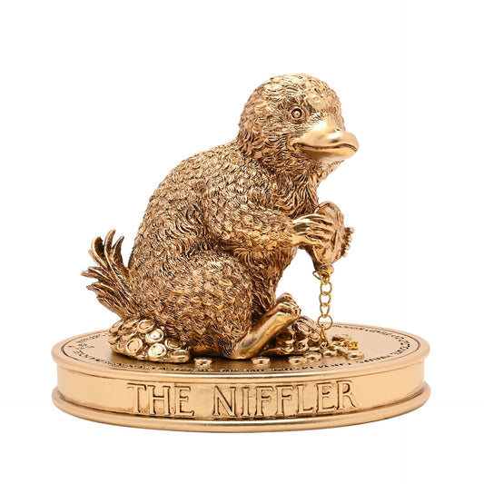 Niffler figurine with textured golden-brown fur, beaded chain, on round base