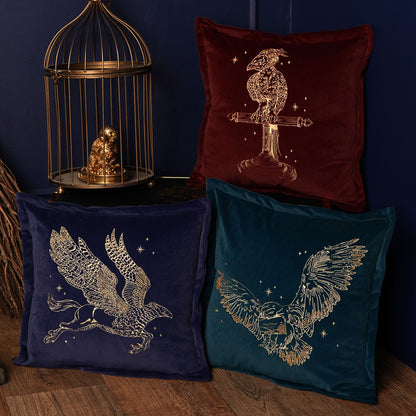 Navy velvet Buckbeak cushion with gold embroidered griffin motif
