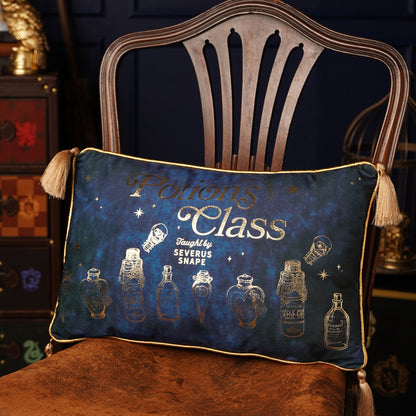 Potions Class velvet cushion with gold piping, tassel corners, blue fabric and potion artwork