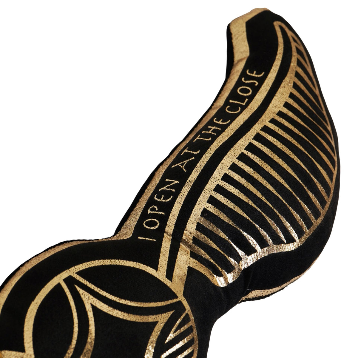 Black velvet wing cushion with 'OPEN AT THE CLOSE' text and gold decorative outline
