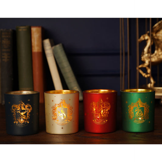 Set of 4 tealight holders with house crest designs in dark, cream, red, and green