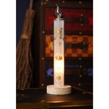 Tall LED light candle with house emblem graphics, clear flame top, on round wooden base