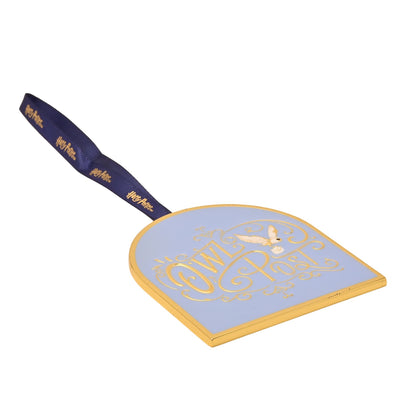 Harry Potter Owl Post metal ornament with gold frame and dark blue ribbon, angled view