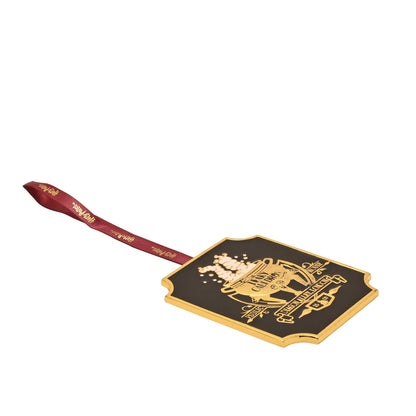 Leaky Cauldron metal hanging decoration angled view with red ribbon