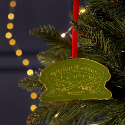 Flying Lesson Hogwarts metal ornament with green ribbon and gold edge