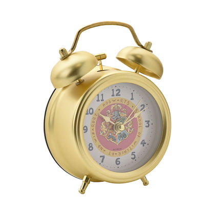 Gold twin-bell alarm clock close view of Hogwarts crest dial