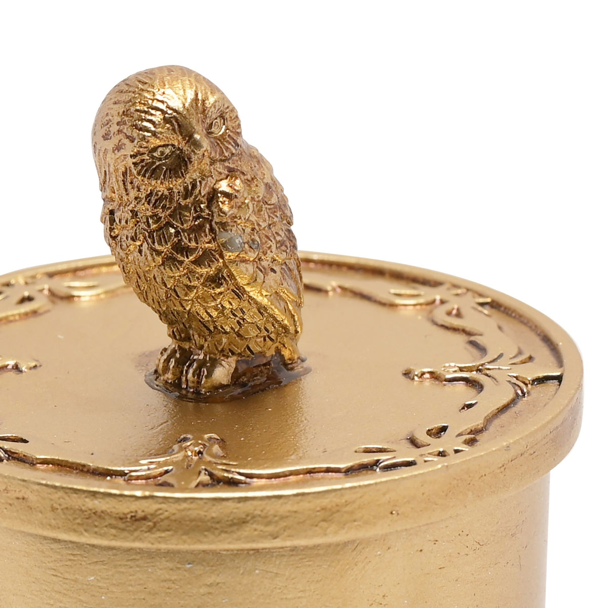 Close-up of gold Hedwig trinket box lid with owl figurine and etched details