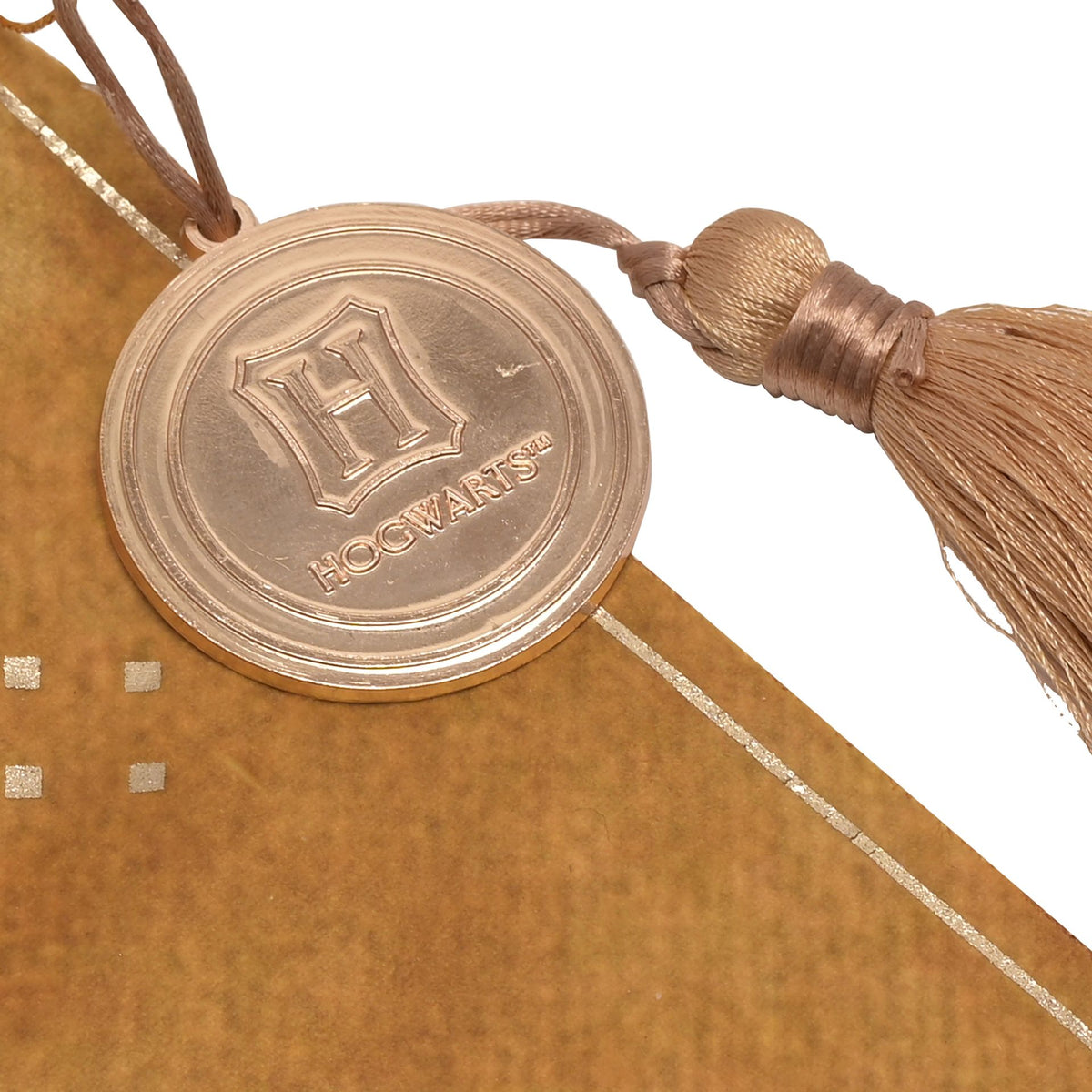 Close-up of Hufflepuff hanging banner crest seal and rope tie with tassel