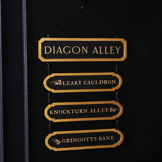 Gold-lettered hanging wooden signs: Diagon Alley, Leaky Cauldron, Knockturn Alley, Gringotts