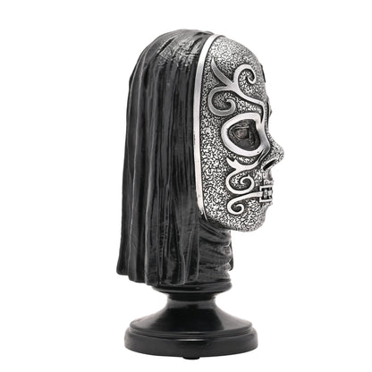 Side view of Death Eater bust figurine with silver skull face and black hood