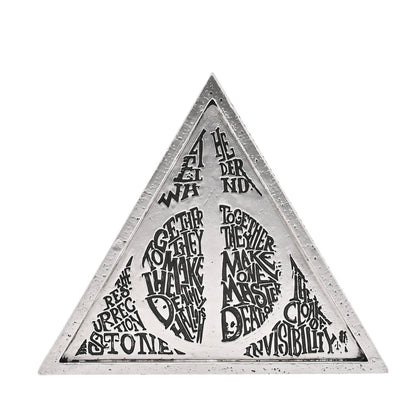 Triangular white metal plaque with black mystical text and Deathly Hallows triangle graphic