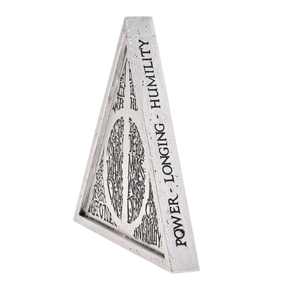 Triangular plaque side view with vertical black lettering including “LONGUM” and “POWER”