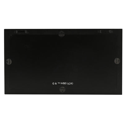 Back of mirrored plaque with corner mounts and © & ™ WBEI text