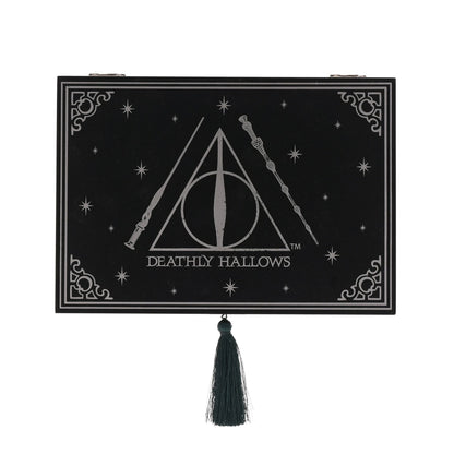 Rectangular black box with “Deathly Hallows” logo and small hanging tassel at front