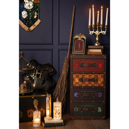 Gold-toned resin candelabra with five candles and ornate arms on a decorative base
