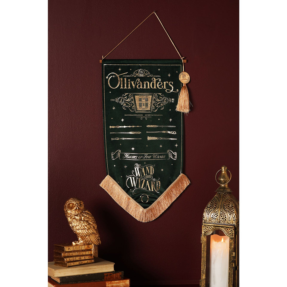 Ollivanders hanging banner on dark green fabric with wand-wizard print and beige tassels